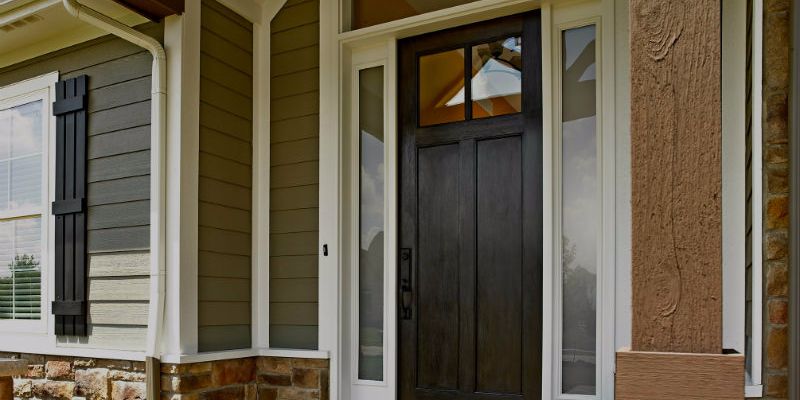A brown, two lite Therma-Tru door.