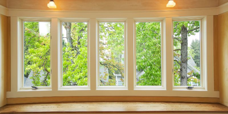 A large casement and bay window in a living room.