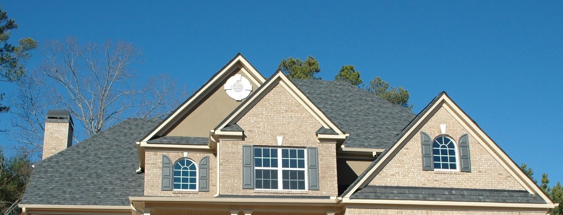 Exterior of Victorian home with new roofing shingles.